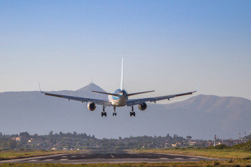 Fototapeta na wymiar Airplane landing on Corfu airport