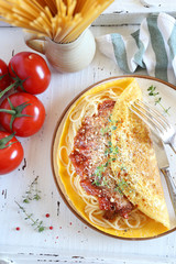 Omelette stuffed spaghetti with Bolognese sauce Parmesan cheese for hearty breakfast