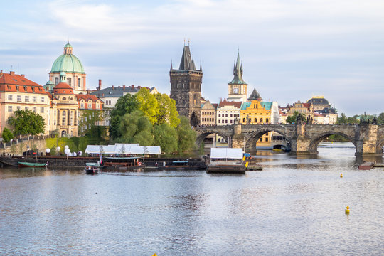 View to the Charles Bridge and St. Nikolaus Church in Prague