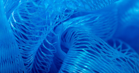 Blue synthetic sponge as an abstract background - obrazy, fototapety, plakaty
