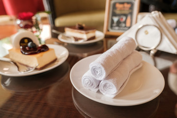 Rolled up white spa towels, selective focus, vintage