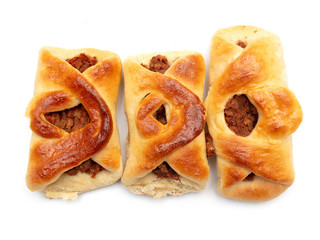 Buns with raisins and jam on a white background