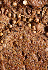 sesame seeds on black bread as a background