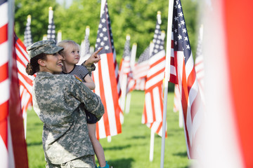 American Female soldier with a little girl