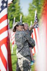 American Female soldier with a little girl