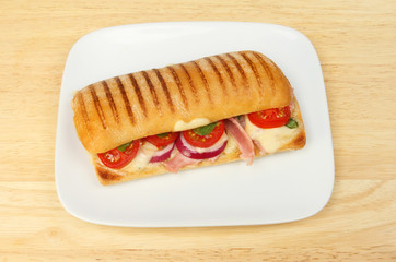 Panini on a plate on a tabletop