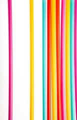 Background with multicolored straws parallel  lines