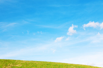 Hill, clouds and sky