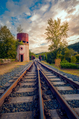 Fototapeta na wymiar train tracks with water tank