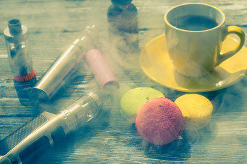 Still life with e-cig and jiuce on the wooden background