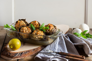 Delicious artichokes stuffed with mushrooms and meat Italian cuisine
