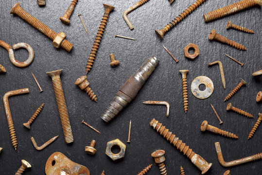 Overhead view of rusty work tools on table
