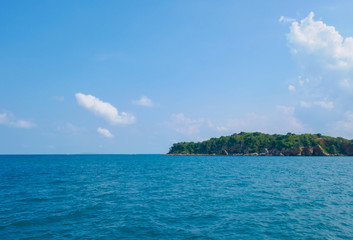 Small island in the middle of the sea and blue sky