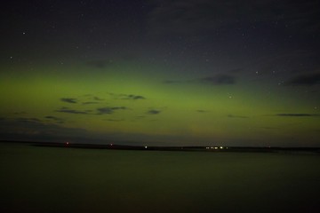 Fototapeta na wymiar Northern lights and Aurora over Lake Superior on the North Shore of Lake Superior in Minnesota