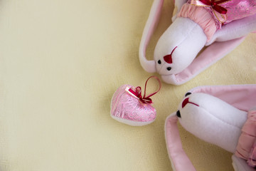 Heart soft toy and toy rabbits on the right.