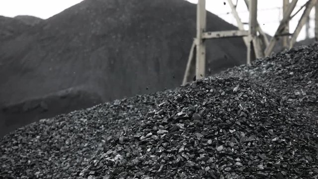 mountain of coal, coal falls from the conveyor