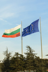 Bulgarian flag and european flag together floating on the wind.