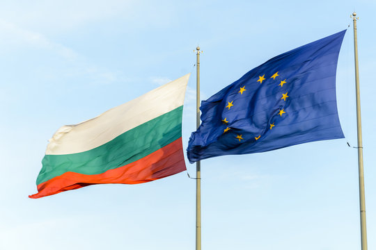 Bulgarian flag and european flag together floating on the wind.