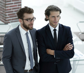 confident businessmen standing together in office