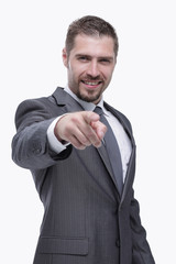 in full growth.closeup.confident businessman pointing forward .