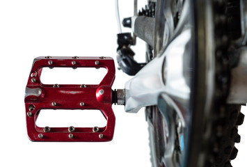 Red bicycle pedal Close-up. Isolated on a white background.