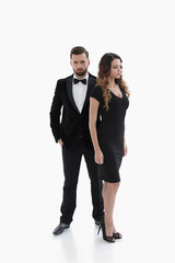 pair of men and women posing for the camera in a studio