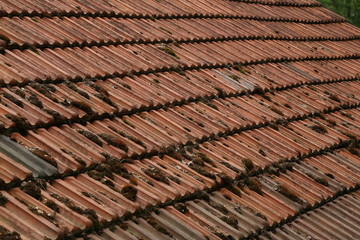 Old tiled roof on a stone house / Details