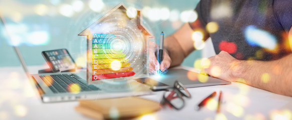 Graphic designer using 3D rendering energy rating chart in a wooden house - obrazy, fototapety, plakaty