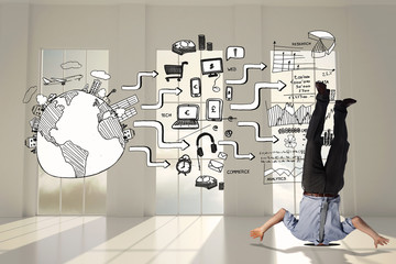 Businessman burying his head against black white graphic in room with windows