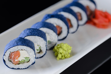 sushi rolls on a black background