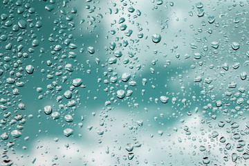 Raindrops on window glass , rainy day