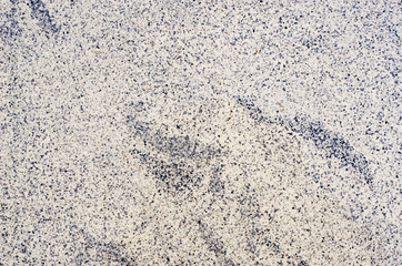 Gray background with black patterns, strips and spots