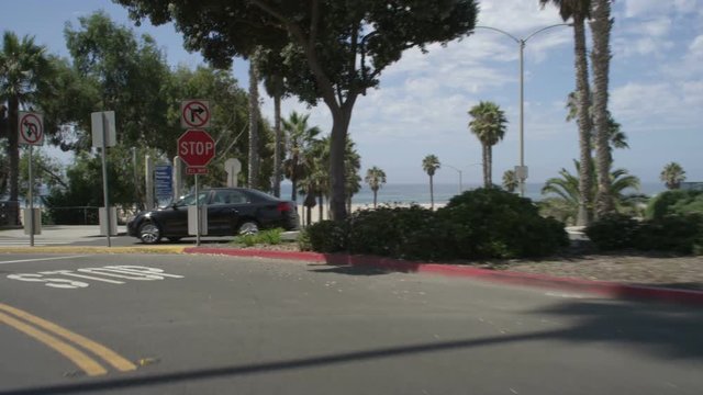 Front view of a Driving Plate: Car traveling on Bicknell Avenue turns onto Ocean Avenue and transitions onto Barnard Way, continuing to Neilson Way in Santa Monica, California.