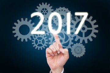 Hand of businessman in suit gesturing against blue background with vignette