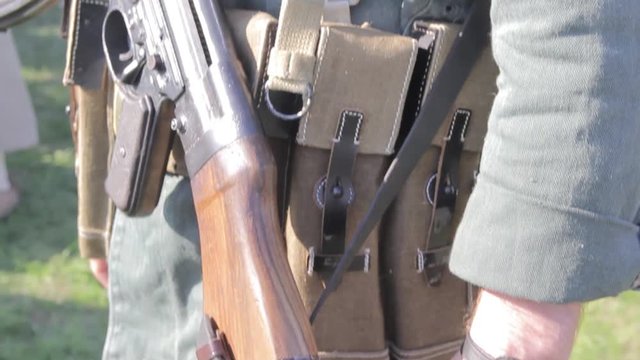 military uniform with a soldier's weapon