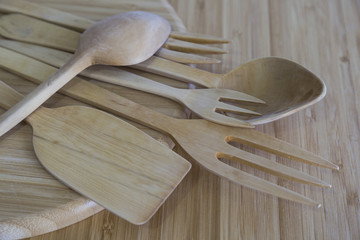 wooden handmade fork,spoon and spatula on the tray for kitchenware concept.