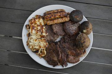 Grilled meat and cheese on a plate