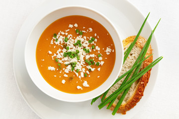 lentils soup puree with bread slice, green onion springs and bryndza cheese
