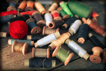 Old  thread  on the old wooden background. Vintage Background
