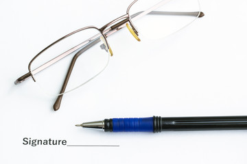On the table is an important document, pen and glasses