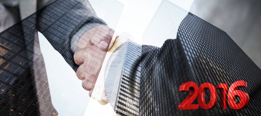 2016 graphic against composite image of business people shaking hands close up