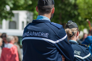 Brisach - France - 1 May 2018 - french gendarmerie patrol in lily of the valley party in the street - 203129957