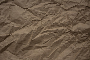 Brown rough crumpled recycled paper texture