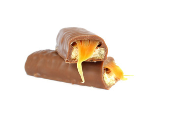 Chocolate bar with caramel and cookie isolated on white background


