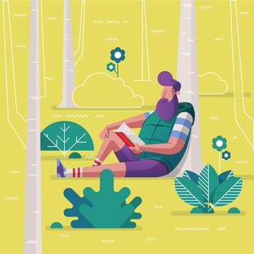 Man sitting in the park and reading