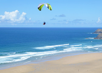Paraglider above Perranporth Beach