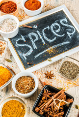 Set of various spices on light concrete background. Copy space.