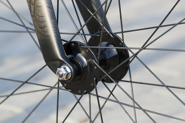Detail of front bicycle wheel, hub and spokes
