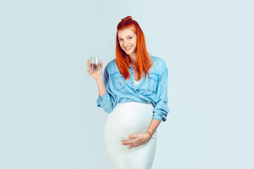 Healthy pregnant woman with glass of water