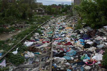 pollution concept with garbage in railroad lane in third world country